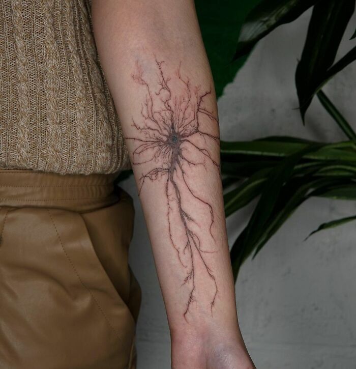 Neuron tattoo on arm