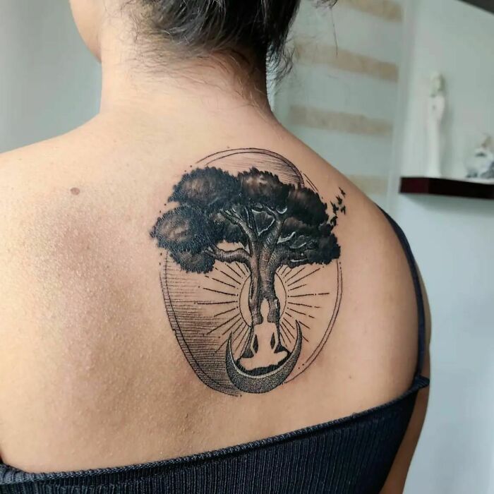 Tree with sun and monk in front of it back tattoo