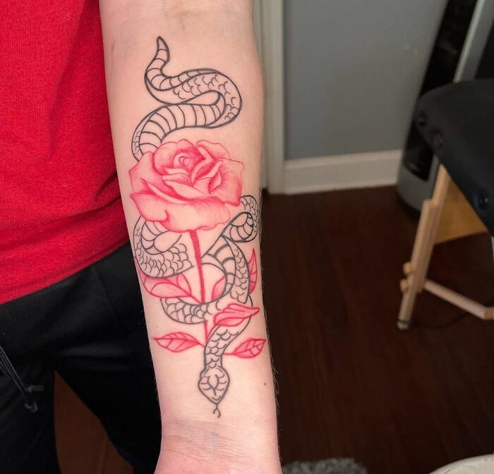 snake and rose tattoo on the hand