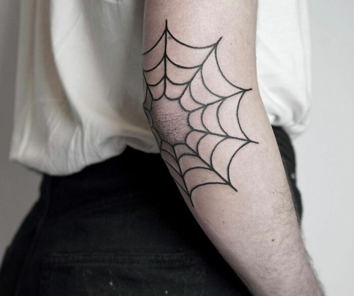 Spider web tattoo on the elbow