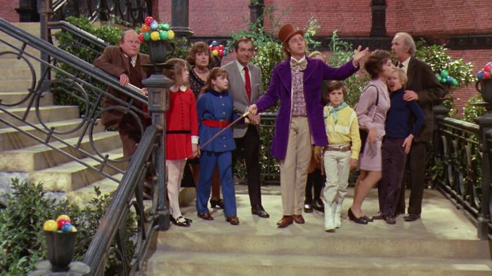 Willy Wonka showing his factory 