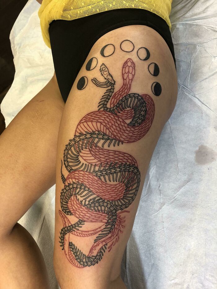 snake thigh tattoo