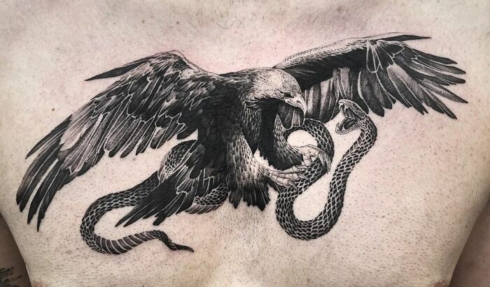 Eagle attacking a snake tattoo