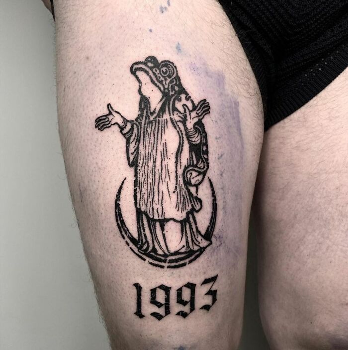 frog giving blessings upper thigh tattoo