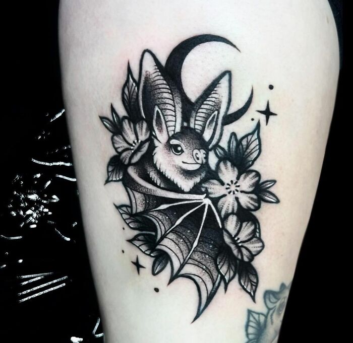 stylized contrasting bat tattoo