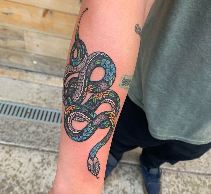 snake forearm tattoo