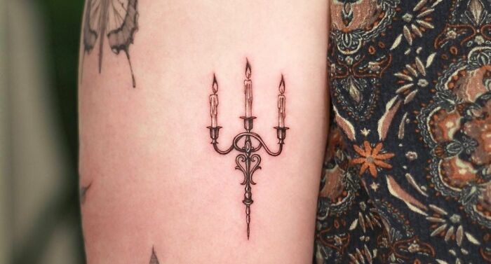 fancy Triple candle arm tattoo