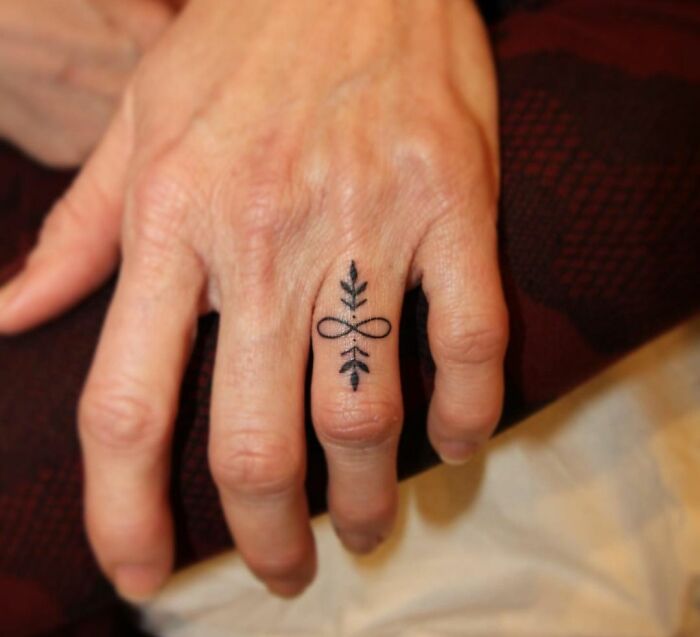 infinity tattoo on the finger