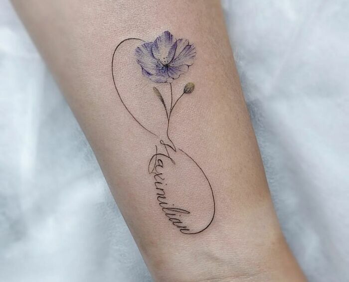 blue poppy flower infinity tattoo on hand