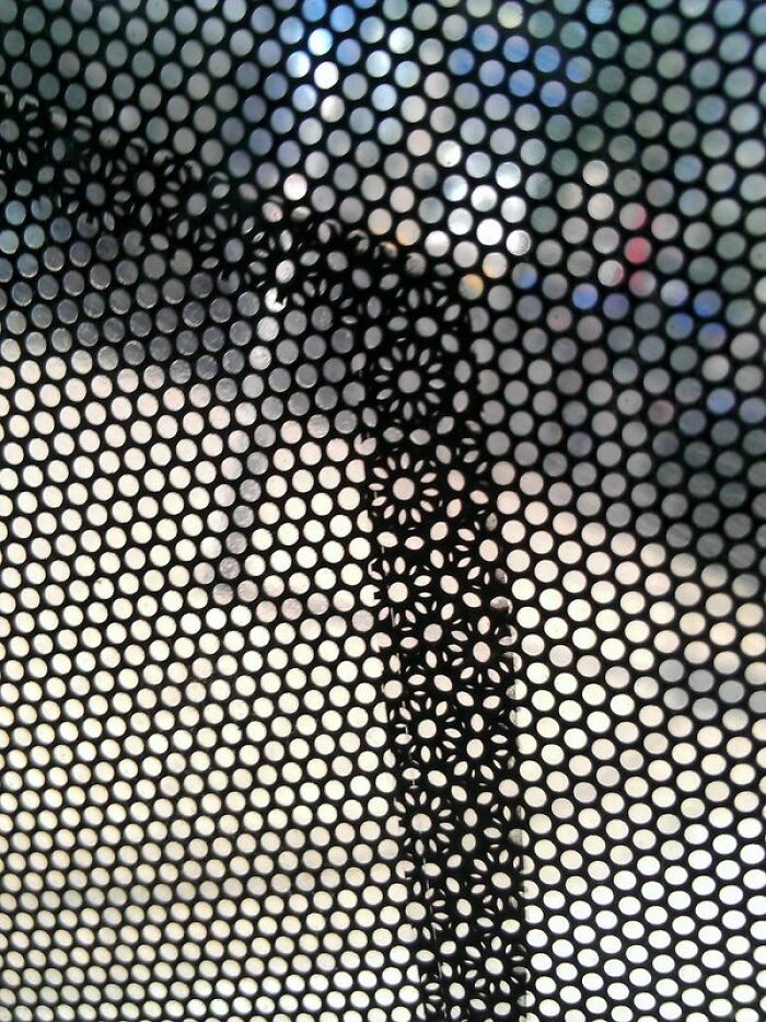 The Perforated Window Vinyl On This Bus Forms A Flower Pattern In Overlapping Areas