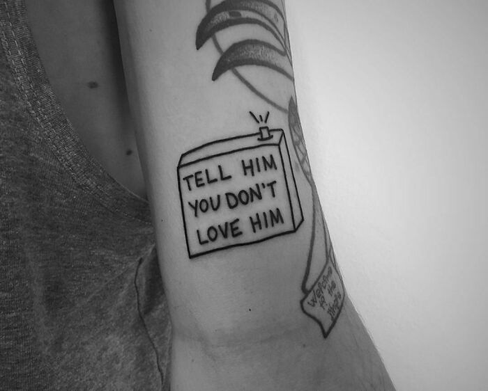 "Tell Him You Don't Love Him" phrase tattoo 