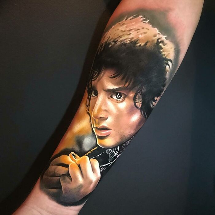 Frodo holding the one ring tattoo 