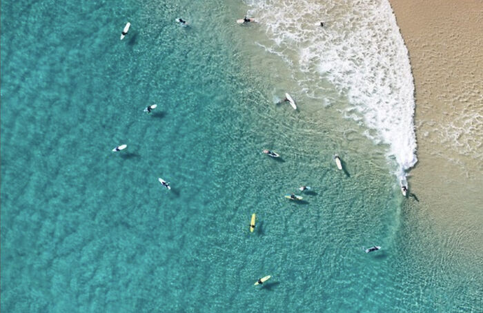 An Aerial Photograph Of Surfers In Byron Bay