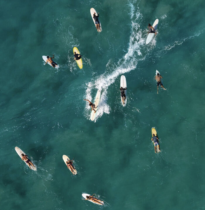 An Aerial Photograph Of Surfers In Byron Bay