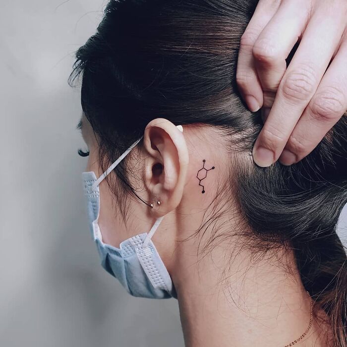 Dopamine molecule ear tattoo