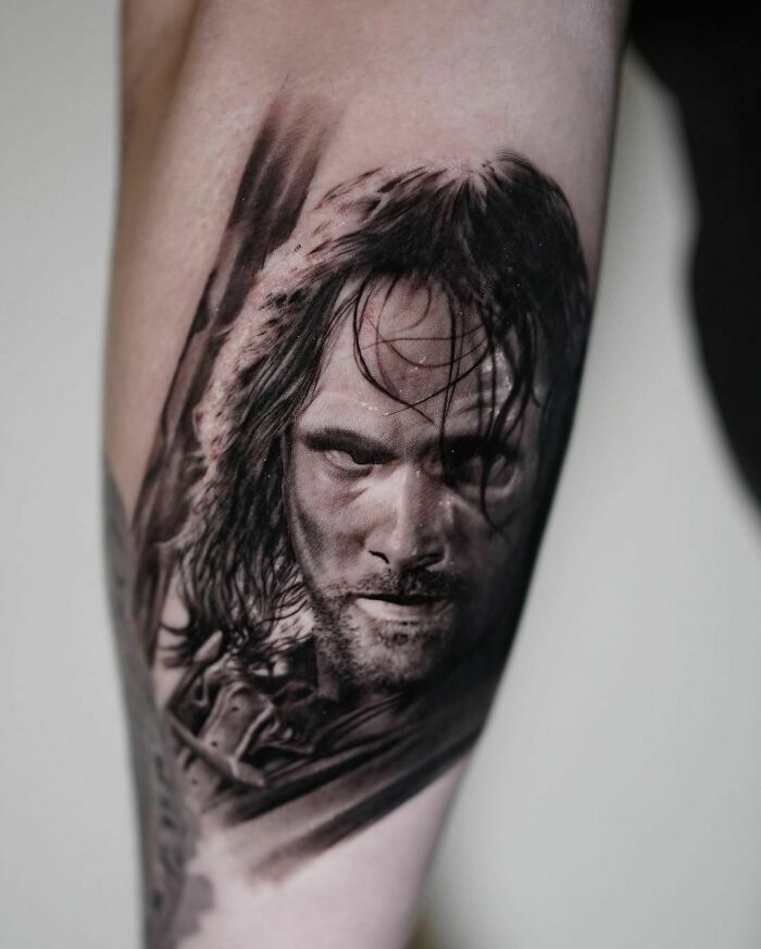 Aragorn holding a sword tattoo
