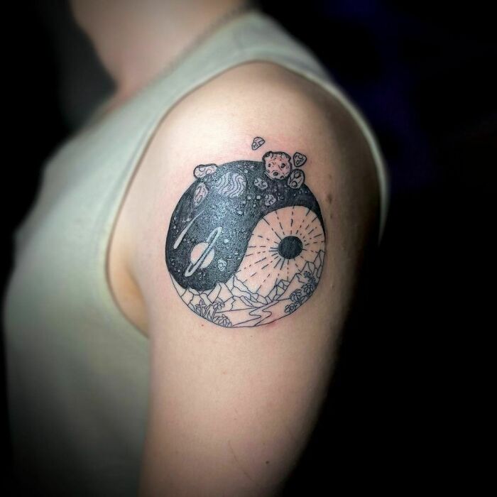 Space and planet forming yin yang symbol tattoo 