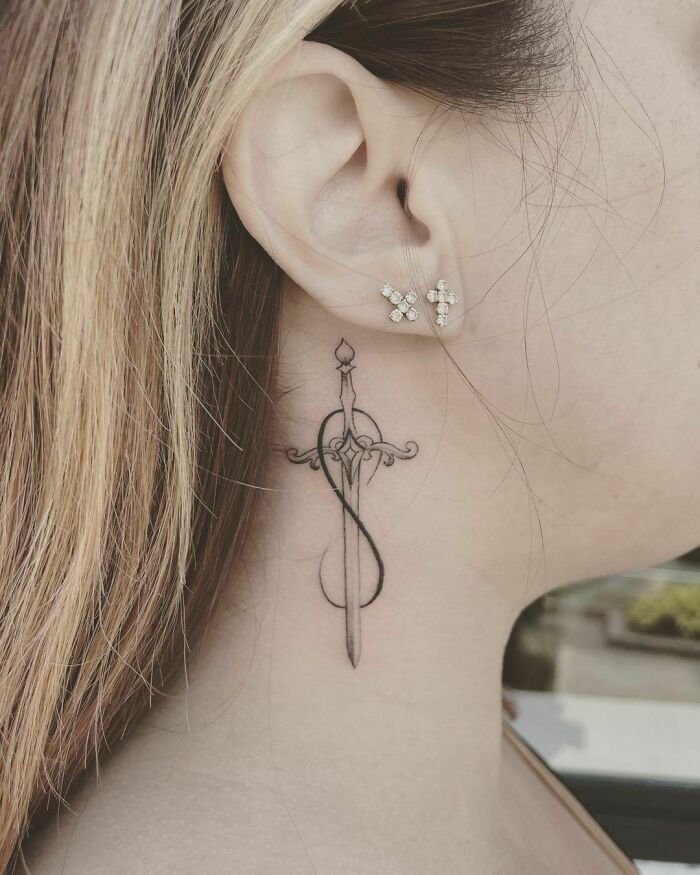 dagger infinity tattoo on the neck