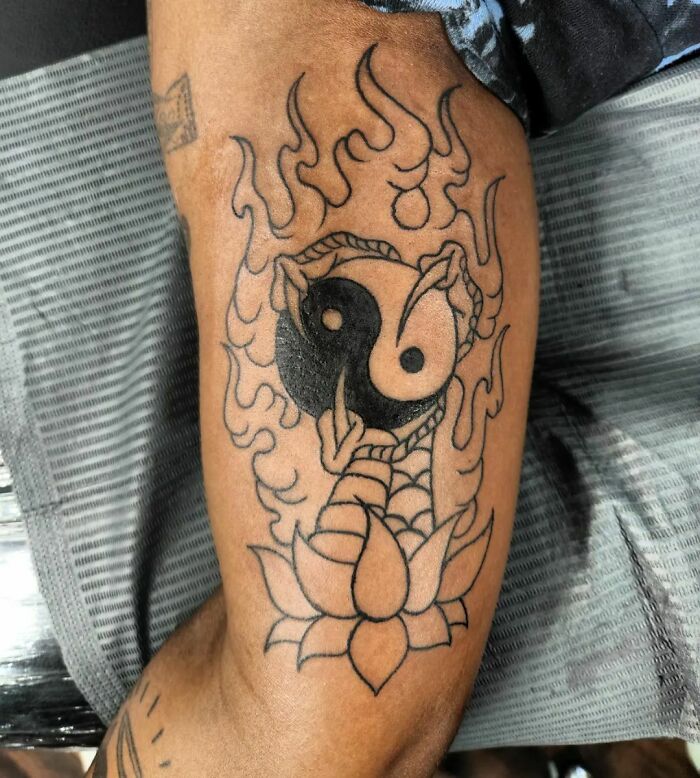 Yin Yang with dragon claw tattoo 