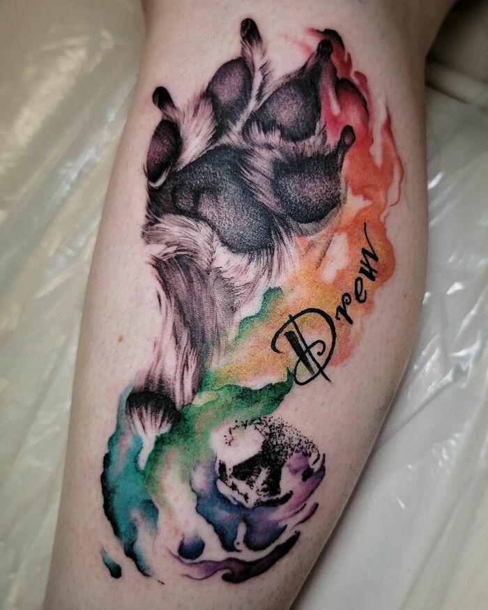 Watercolor pet footprint with the name script tattoo