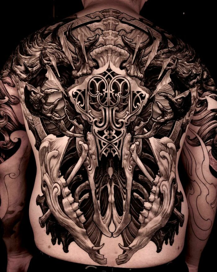 Highly Stylized Baroque Skull full back Tattoo