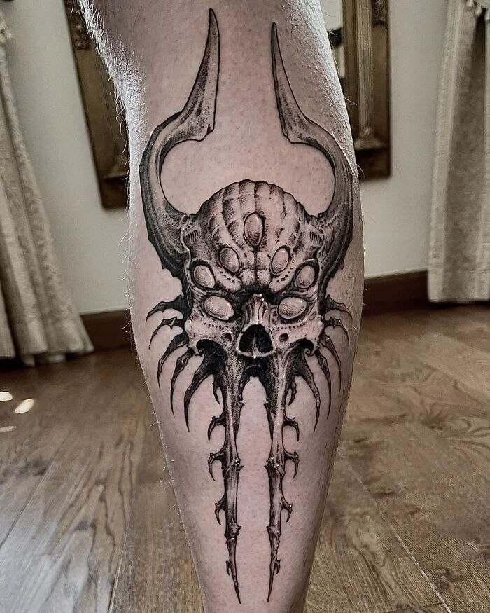 Gothic Stylized Skull with seven eyes Tattoo