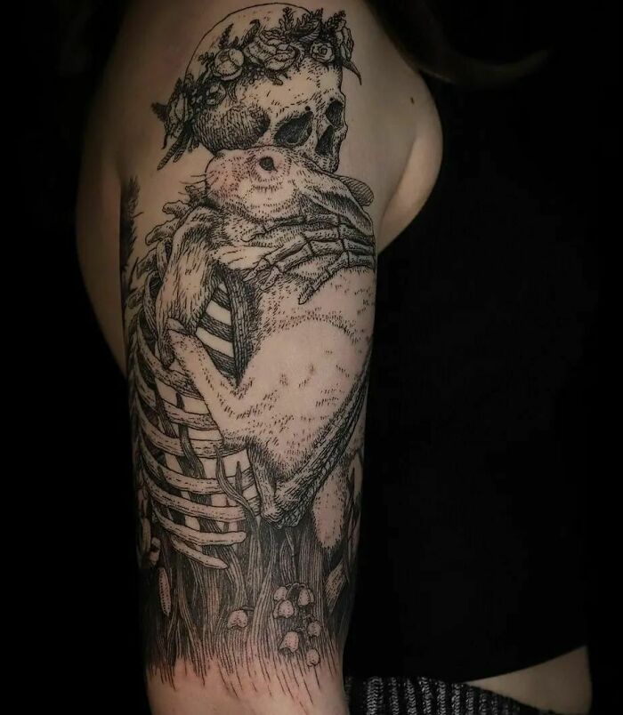 Skeleton hugging a rabbit tattoo