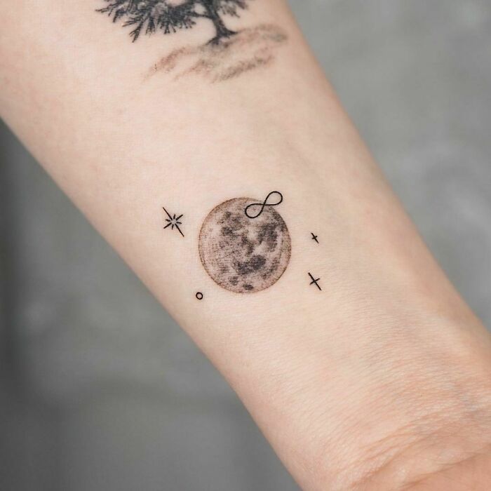 infinity planet tattoo