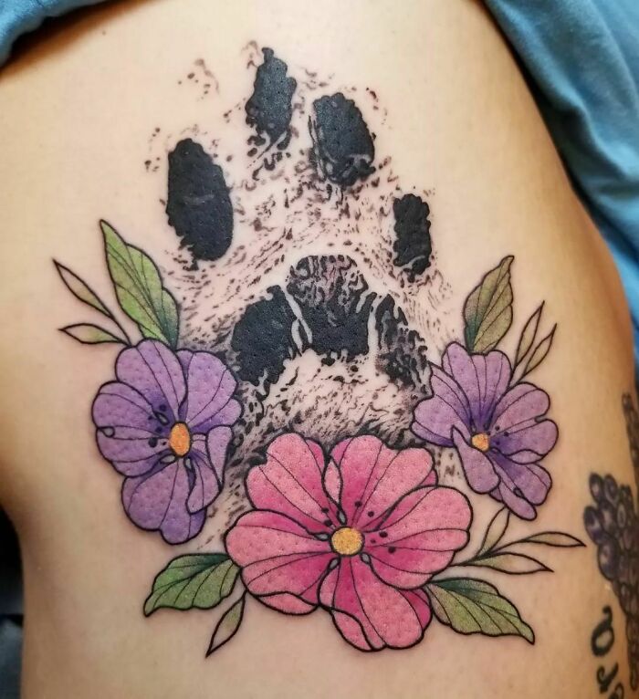 Pet footprint and colored flowers tattoo