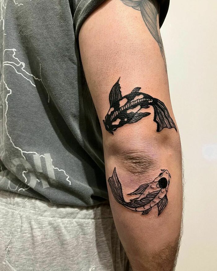 Two fishes yin yang symbol tattoo 