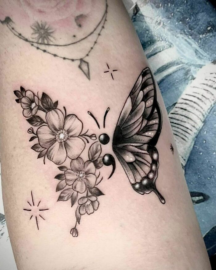 Butterfly and flowers tattoo