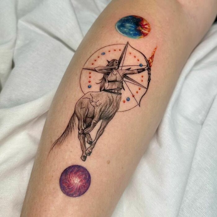 Colorful Sagittarius arm tattoo