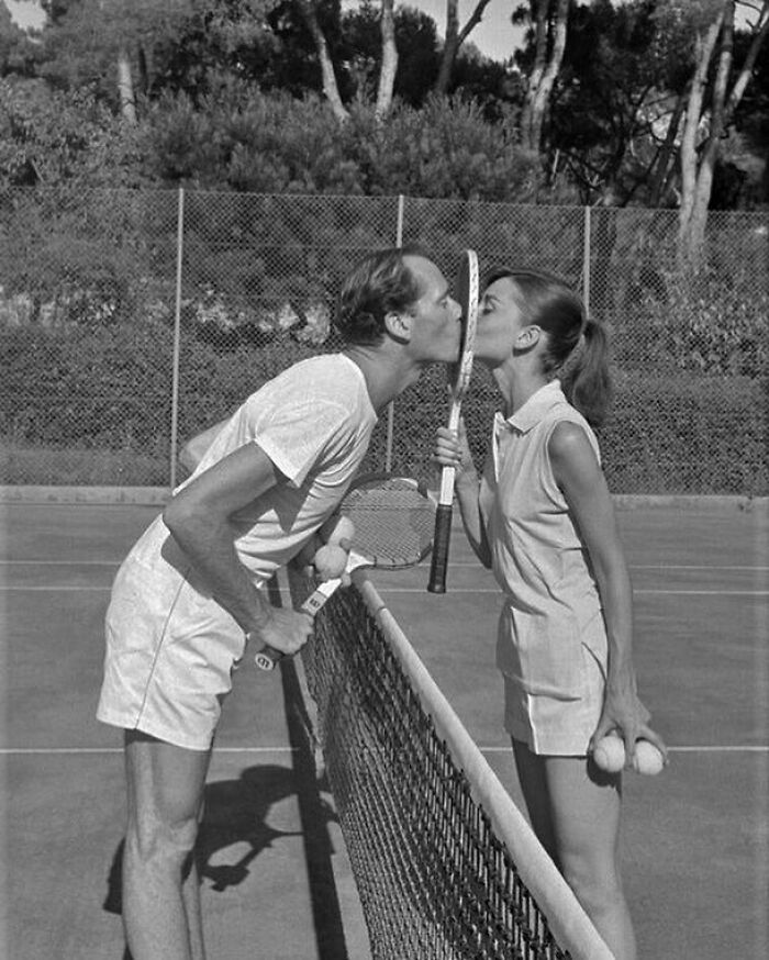 Mel Ferrer And Audrey Hepburn Sharing A Kiss During A Tennis Match In Cap D'antibes, France, 1956. Photo By Simon Michou