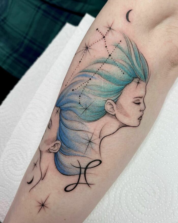Watercolor Gemini arm tattoo