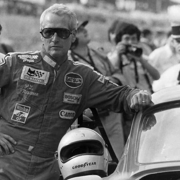 Paul Newman Leaning Against His Race Car Before The Start Of The Le Mans 24-Hour Race, June 11, 1979