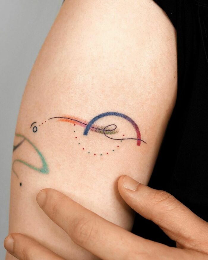 Abstract and colorful hand Tattoo
