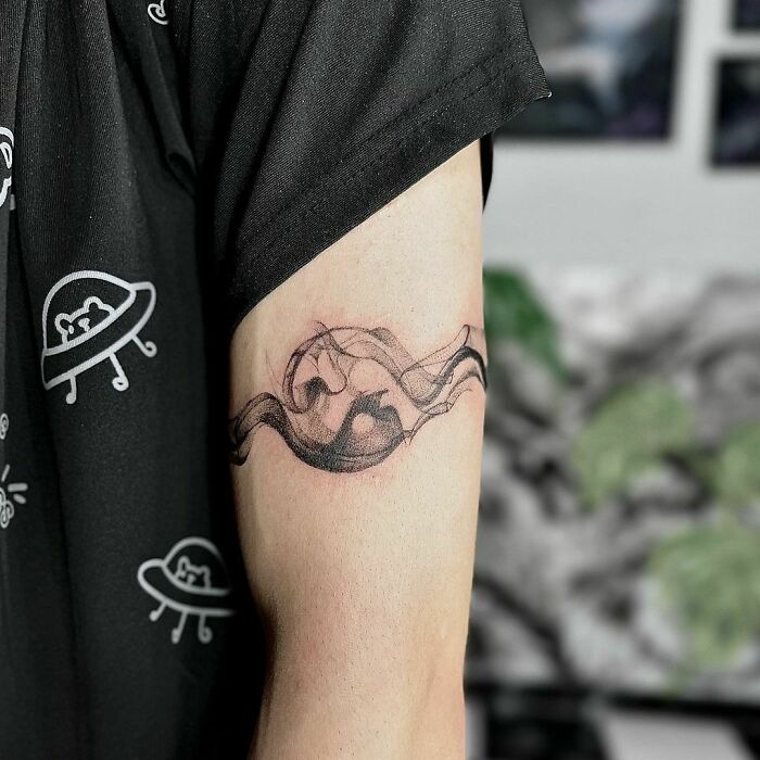 Abstract yin yang symbol tattoo 