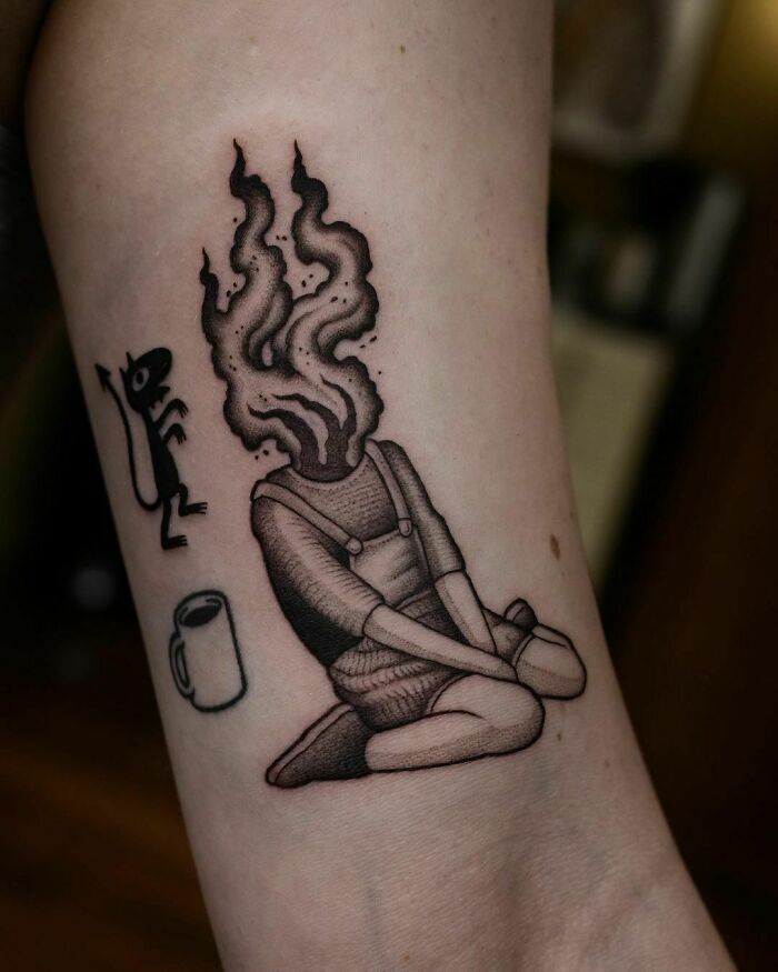 Girls' head on fire tattoo 