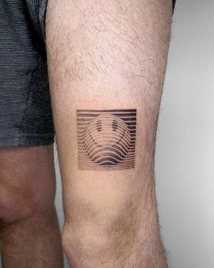 Smilely Face Abstract leg Tattoo 