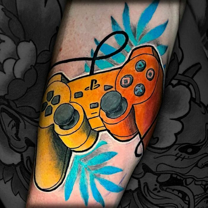 Oraange joystick Tattoo