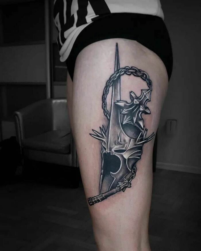 Sauron's helmet and mace leg tattoo 