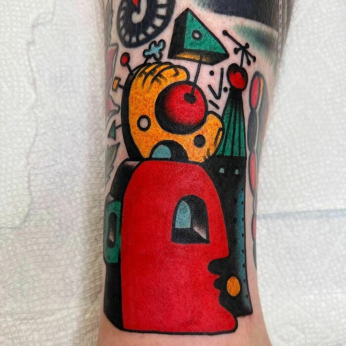 Abstract and colorful leg Tattoo