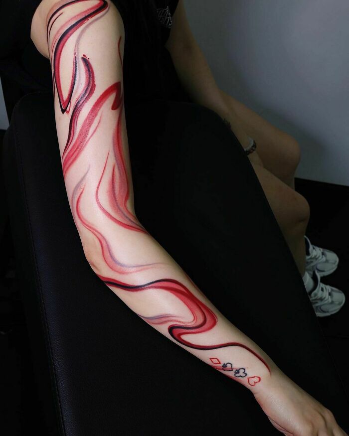Abstract and colorful Arm Tattoo