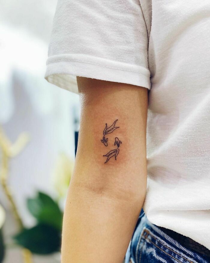 Koi fish arm tattoo