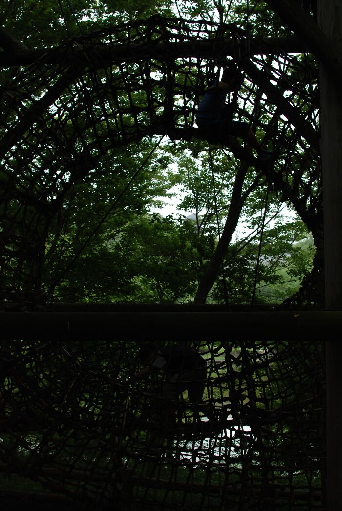 Jungle Gym At Andersen Park, Japan. Kid On Top And Bottom Of The Tree Tunnel
