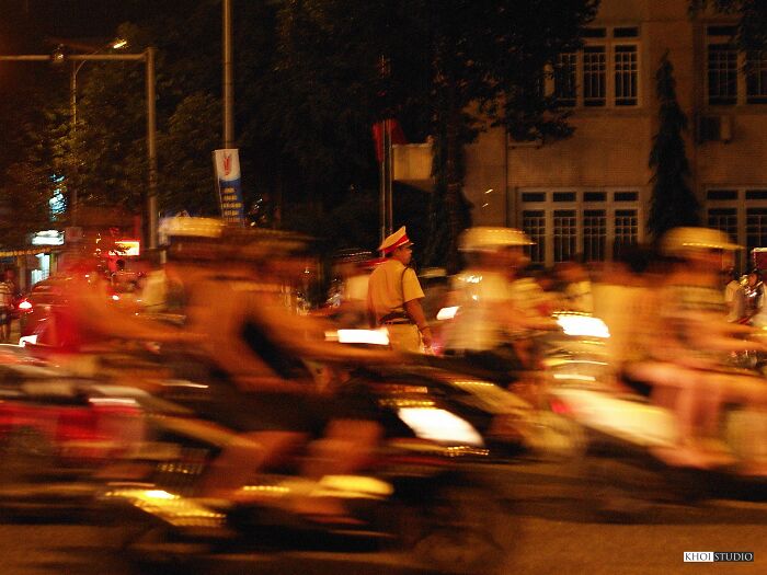 The Traffic Policeman Stood In The Middle Of A Crowd Of Motorbikes. Manual Focus (Instead Of Af) At Night, For Moving Subjects, Really Takes Patience