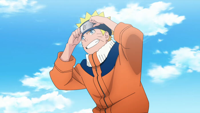 Naruto holding his headband and smiling from Naruto