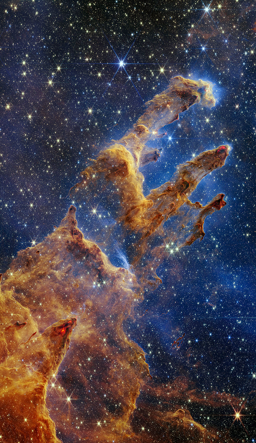 Young Stars Form In 'The Pillars Of Creation' As Seen By The James Webb Space Telescope's Near-Infrared Camera By Nasa