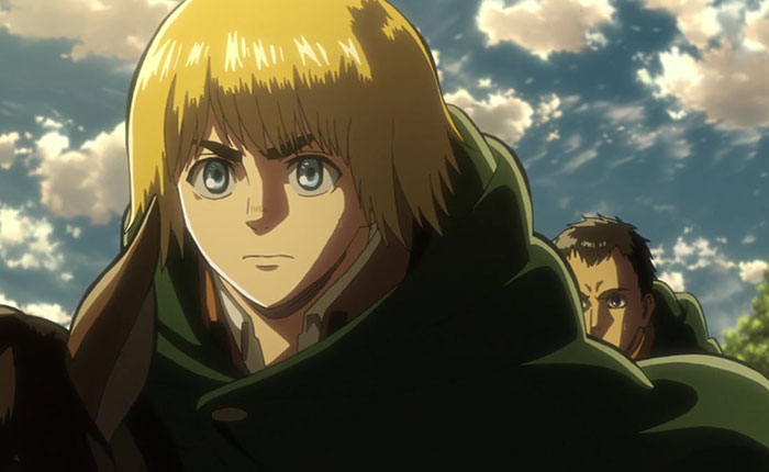 Armin Arlert wearing green outfit