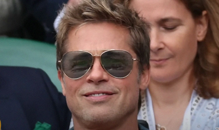 Brad Pitt at Wimbledon, wearing sunglasses and a casual outfit, creating buzz over his age. Brad Pitt at Wimbledon, wearing sunglasses and a casual outfit, creating buzz over his age.